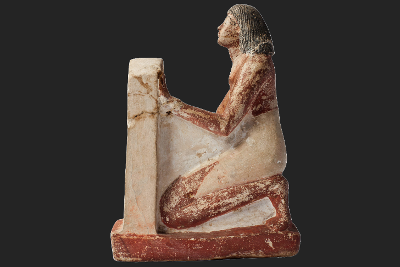 A figurine of a person kneeling