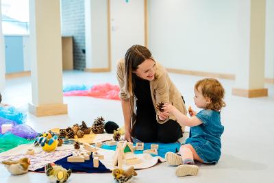 Woman and young child playing in the education room at Norwich Castle